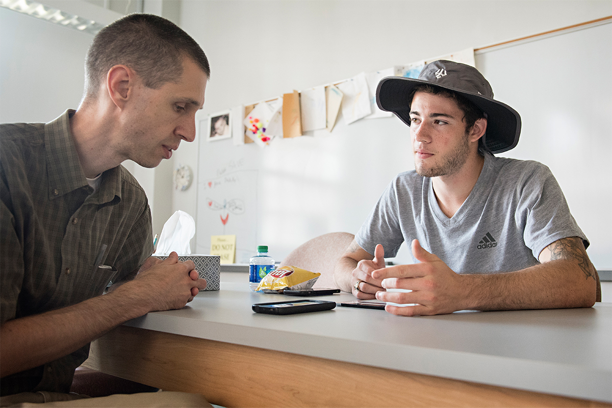 A faculty member coaching a student
