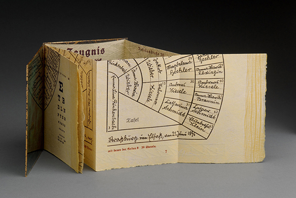 Daniel Mayer; Schrift/werk; 2007; origami artist's book relief printed from photopolymer plates, collagraph, Plexi-glass covers, image transfer process, and gold leaf; created at the Glasgow Print Workshop; 4x6 inches
