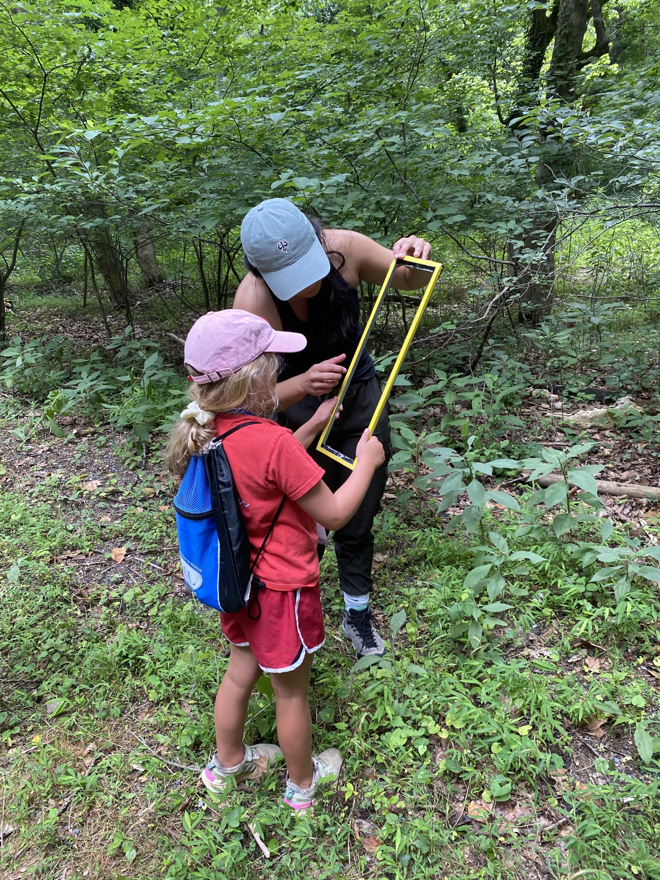 Student working with a child on Woods Creek Trail