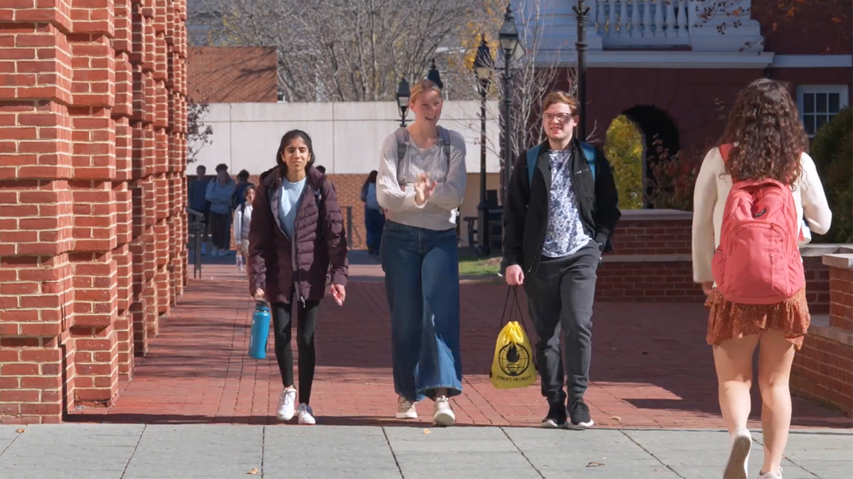 Students walking in front of Elrod Commons on campus.
