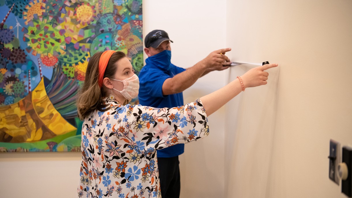 Students setting up Chaos in Color exhibit