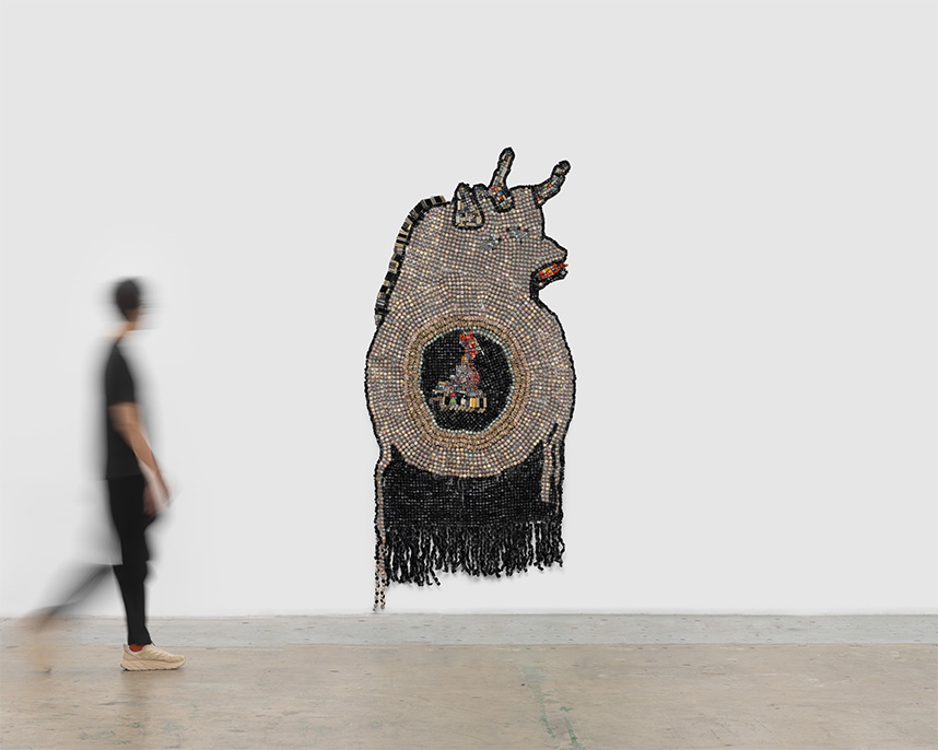 Pregnant Picasso Bull, 2024, Moffat Takadiwa. Zimbabwean bank notes encased in bottle caps, calculator, and computer keys. 107 1/8 x 50 x 2 3/8 in. Image courtesy of Nicodim Gallery. 