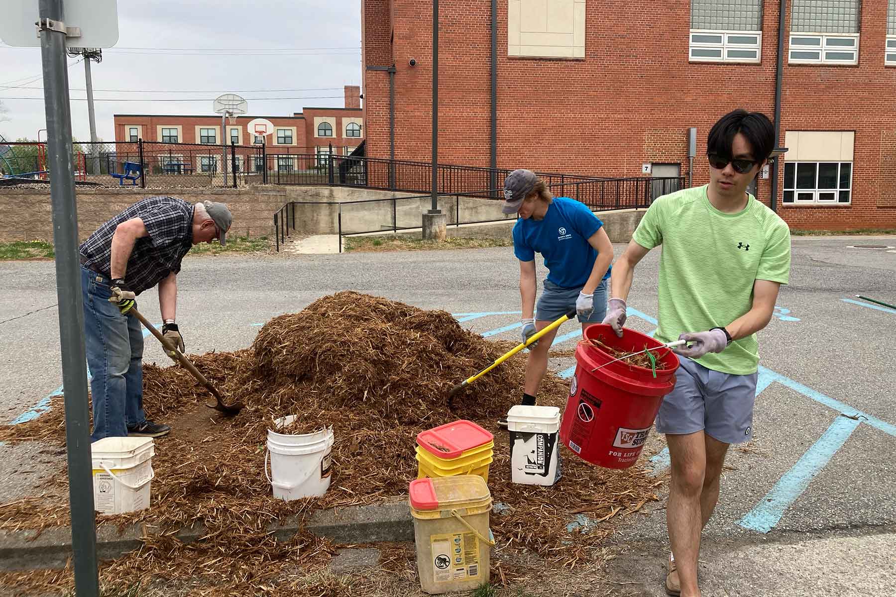 students volunteer at a school during Nabors Service Day