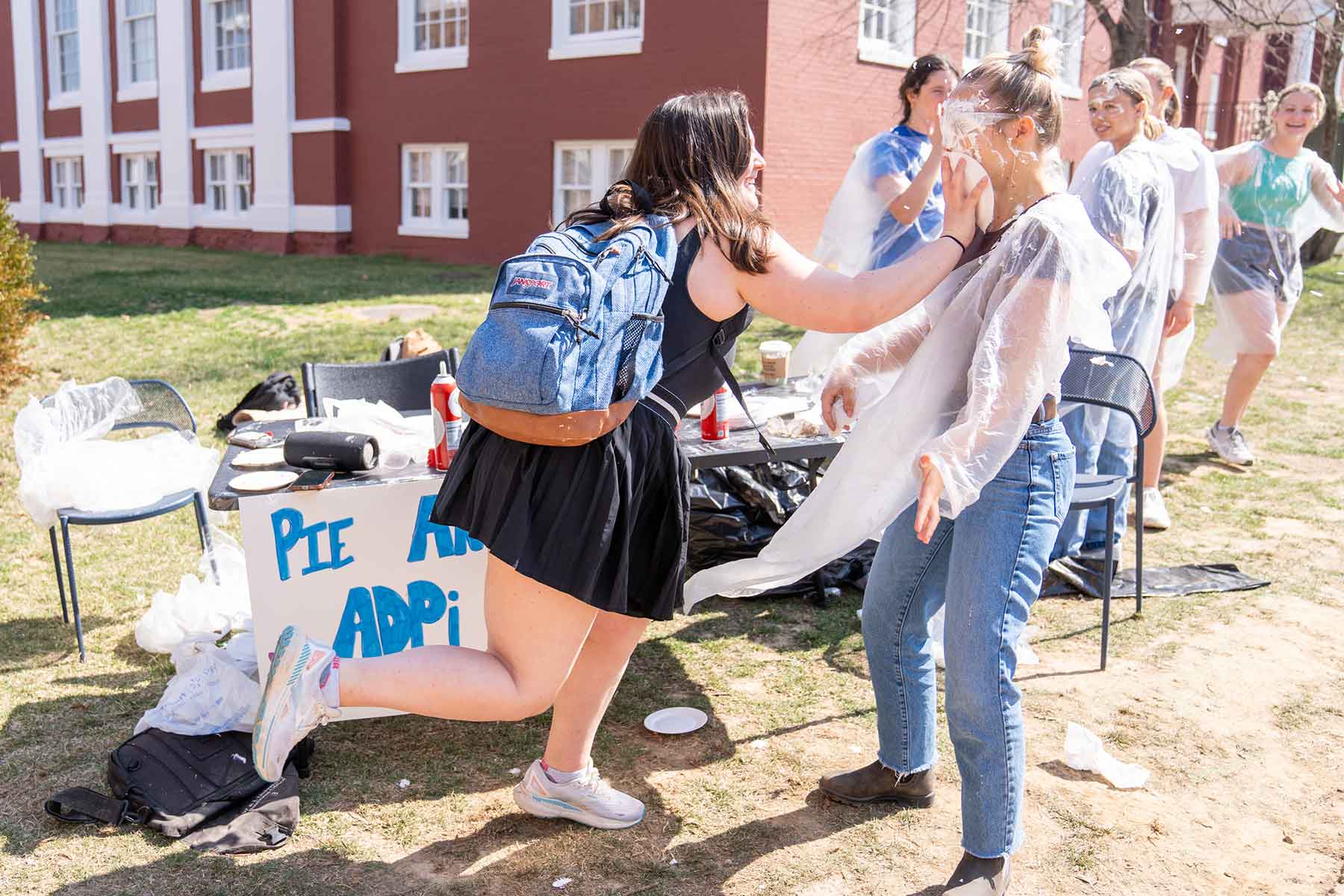A student pies another student at the Pie an ADPi fundraiser  