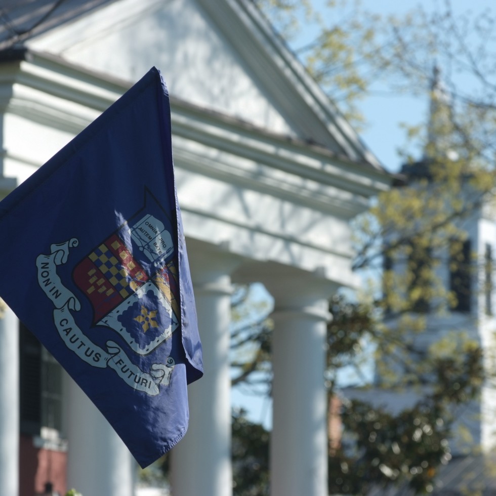 Photo of a W&L flag hanging in front of Washington Hall