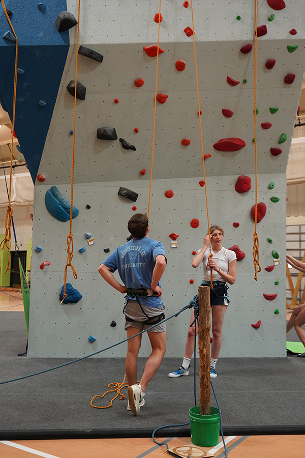 Students next to the bouldering wall