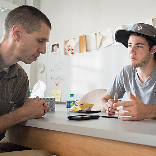 Faculty member meeting with a student