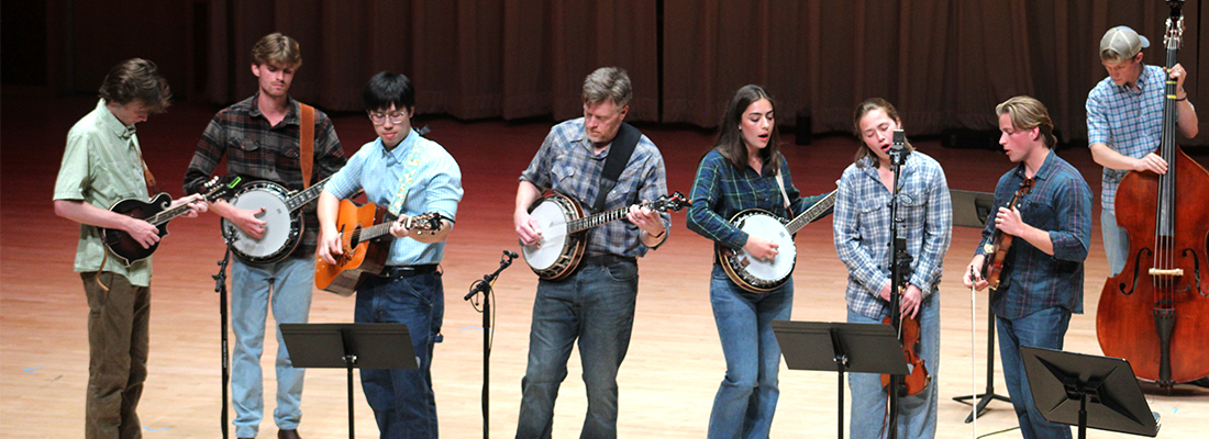 Students performing with Blake Shester, Lecturer in Music, Bluegrass Ensemble