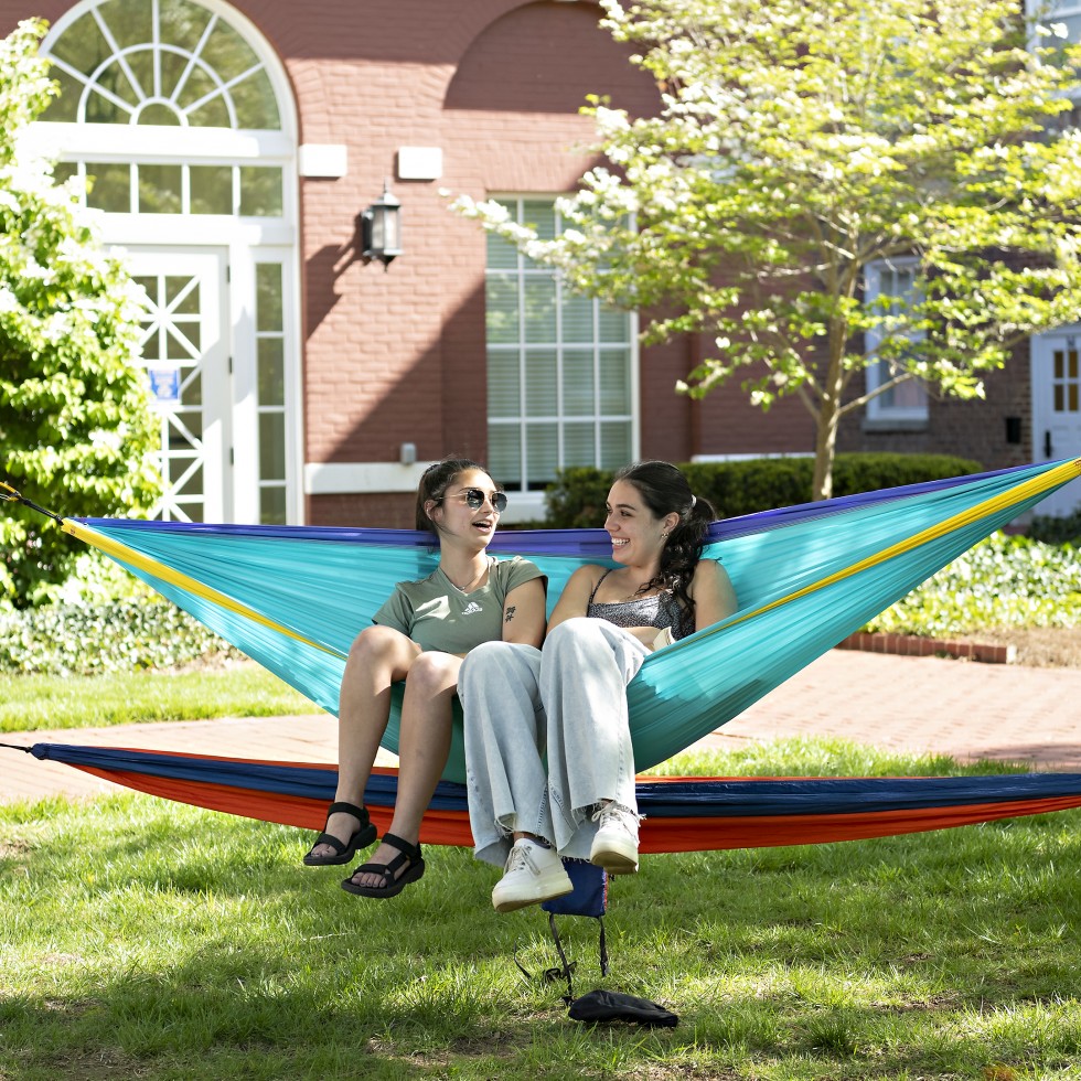 two students in a hammock