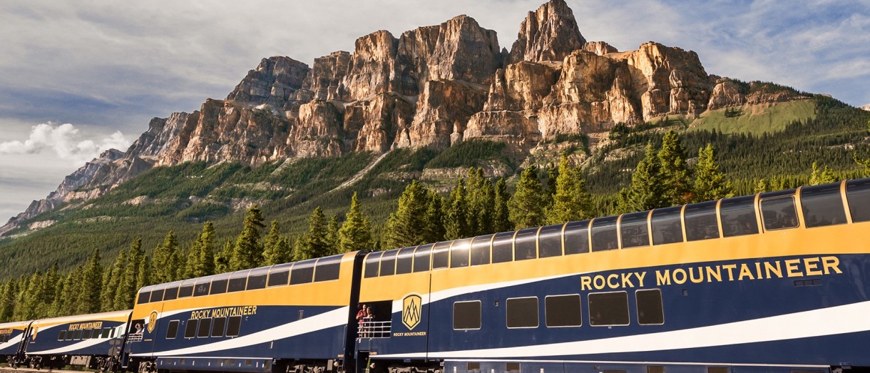 Banner image of the Rocky Mountaineer train promoting the Canadian Rockies by Rail travel program