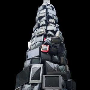 Image of tvs and monitors stacked on top of one another