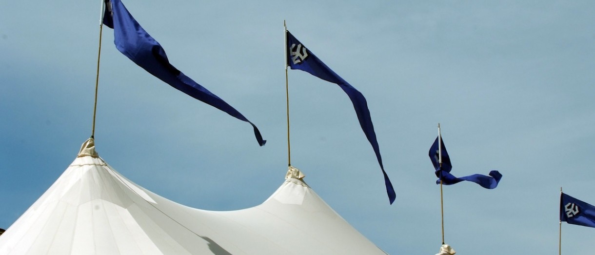 Image of event tents with W&L flags