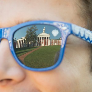 Photo of the reflection of the Colonnade in a person's sunglass lens 
