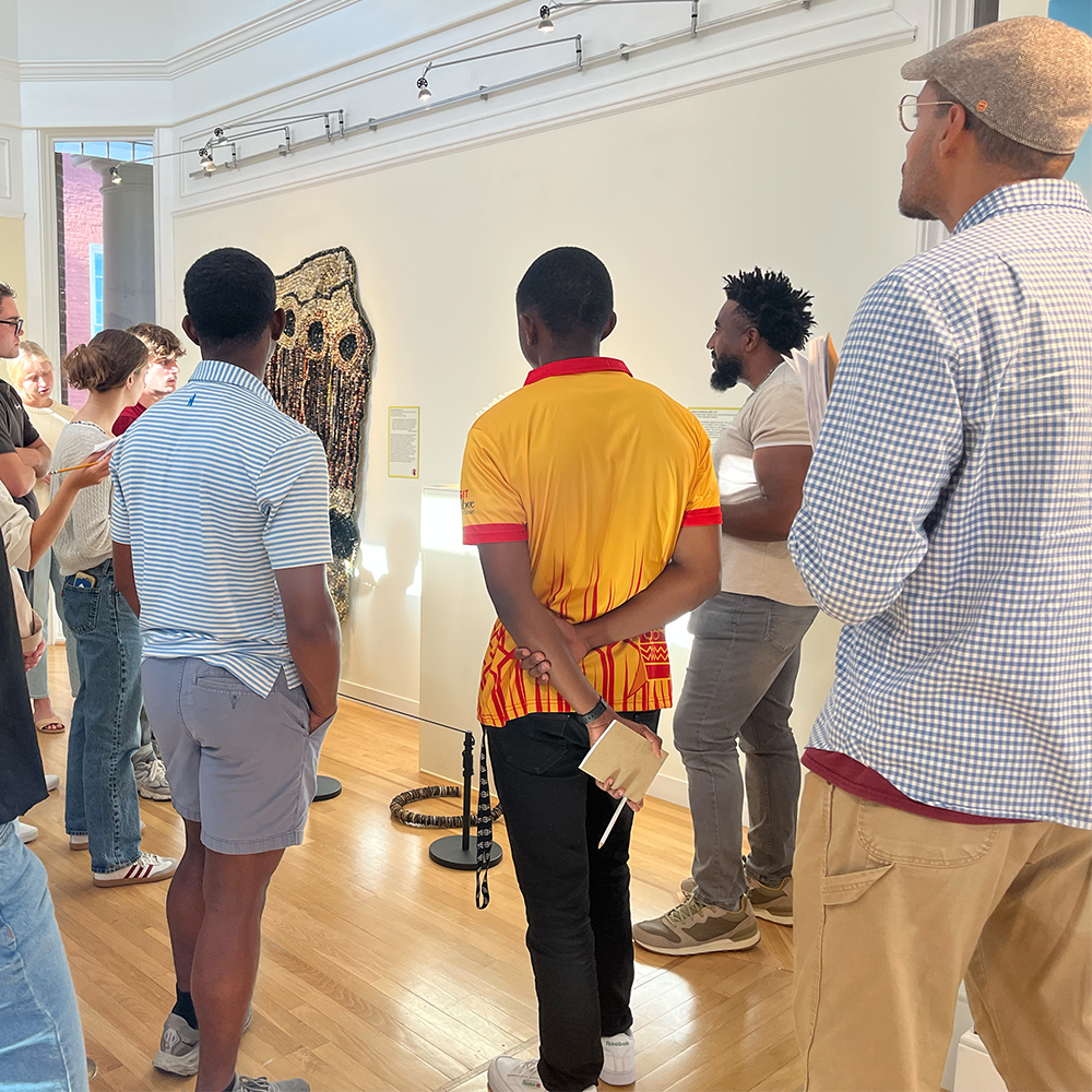Clement Akpang leading an exhibition tour