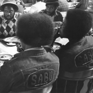 Photo of a early member of the Student Associatio for Black Unity (SABU) in an organization jean jacket