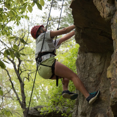 An individual outdoor rock climbing