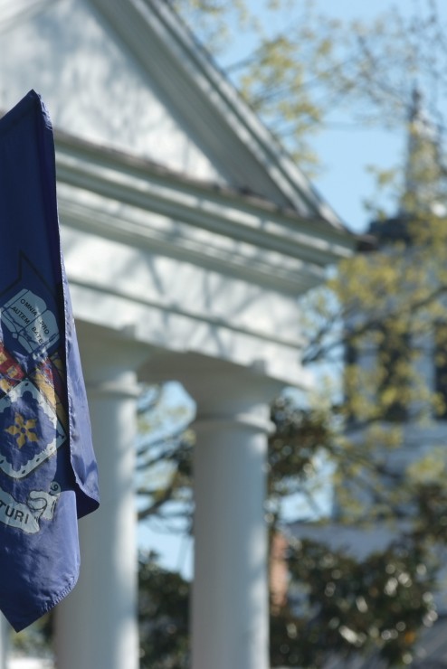 Image of W&L flag hanging in front of Washington Hall