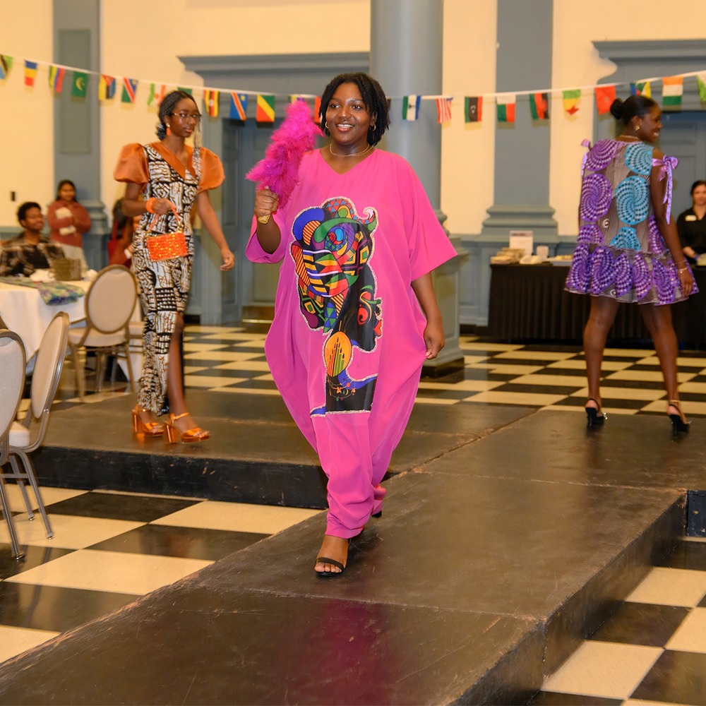 Students walk the runway in the African Society Fashion Show in Evans Dining Hall