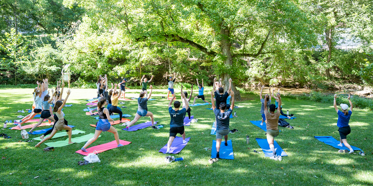 Students doing yoga during a Making Meaning Leading Edge program