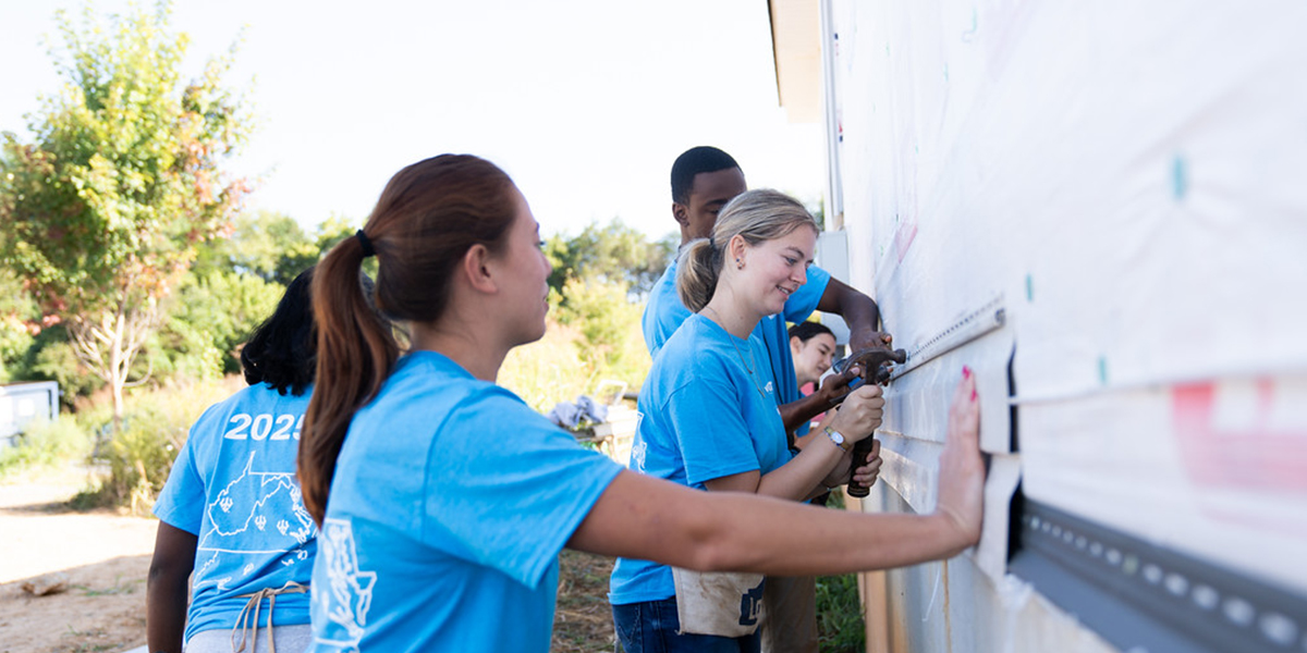 Students working on a house during the Volunteer Venture Leading Edge program