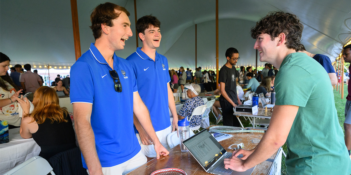 Student signing up for the Squash Club at the Student Activities Fair
