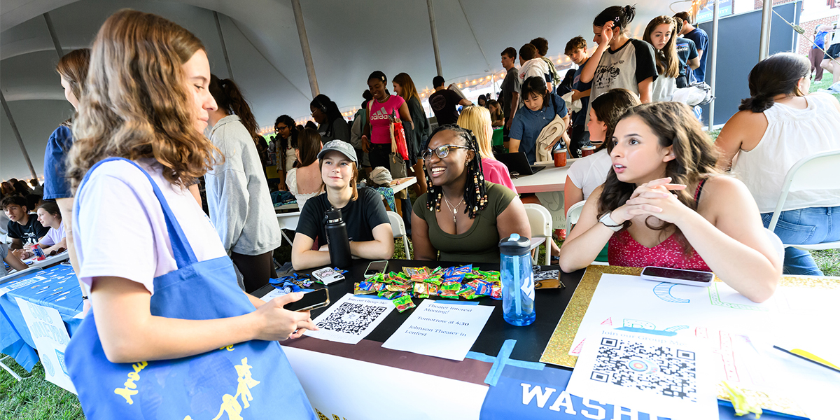 Students chatting at the Activities Fair on Cannan Green
