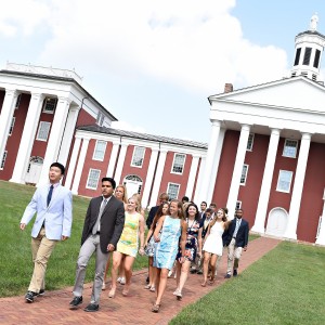 students walking in front of the colonnade
